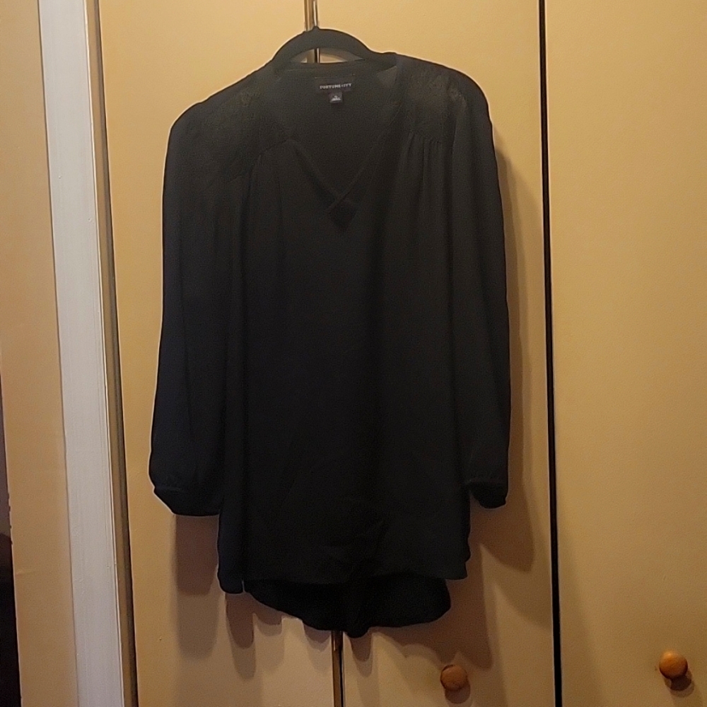 Women's 3/4 length sleeve black dress blouse.